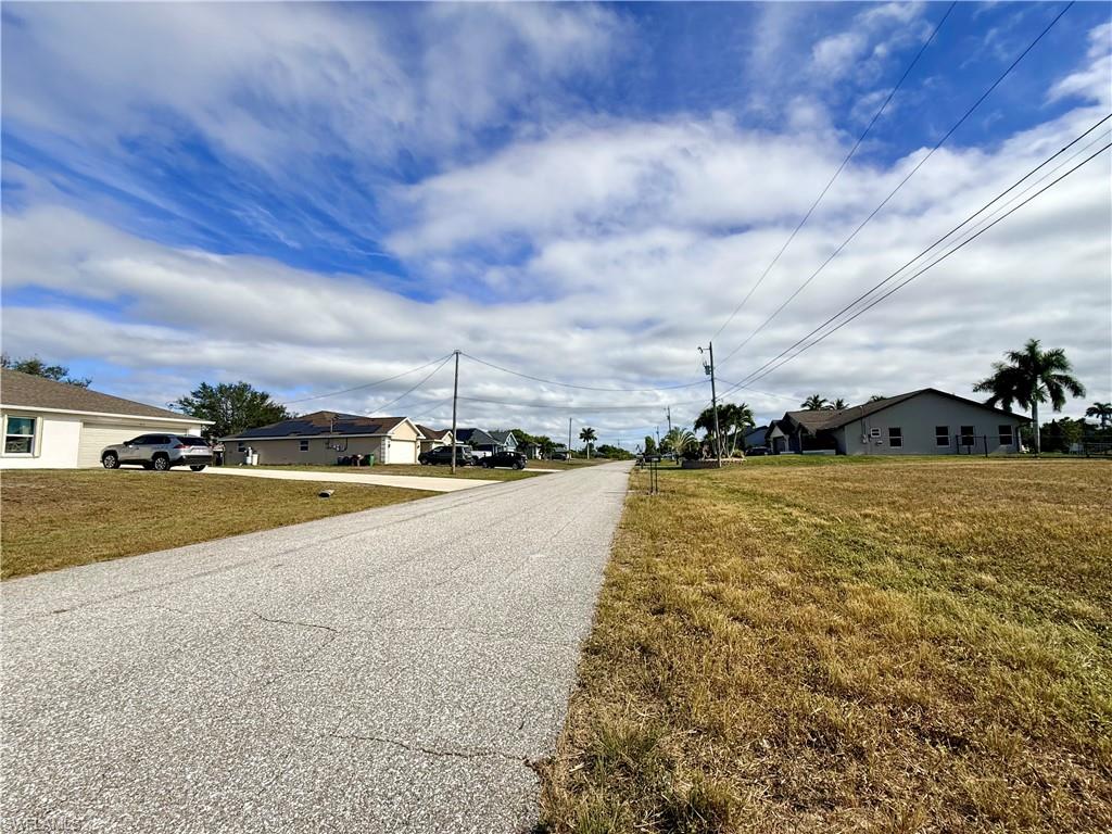 View of asphalt road with a residential view