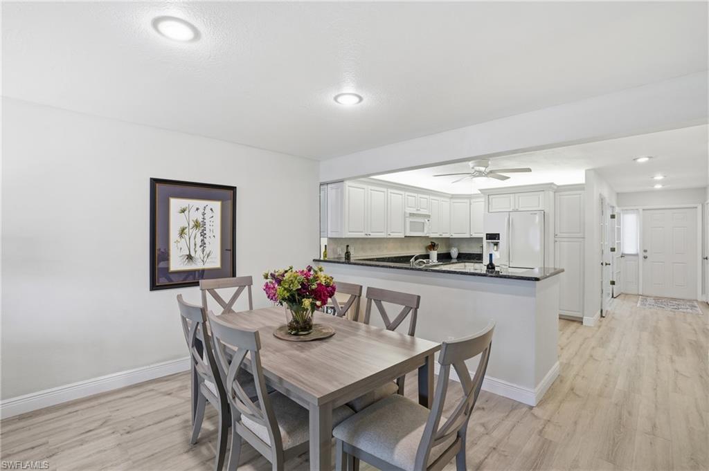 Dining area featuring recessed lighting, light LVP flooring, and ceiling fan