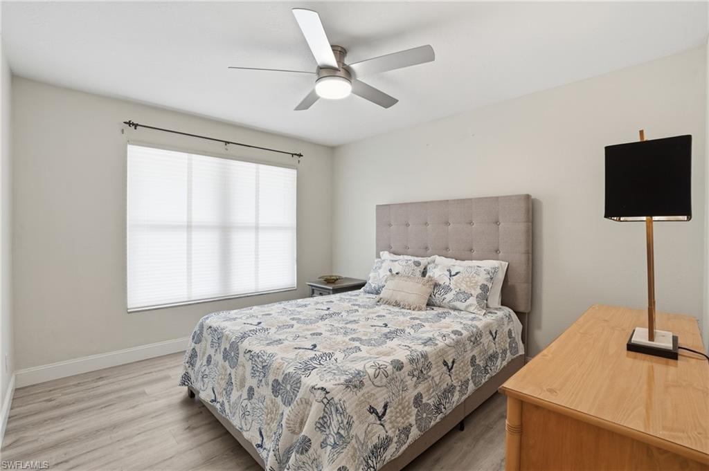 Bedroom featuring light wood-style flooring and a ceiling fan