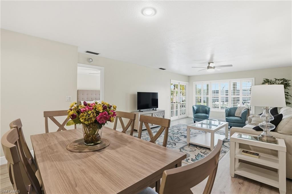 Dining room featuring light LVP floors and a ceiling fan