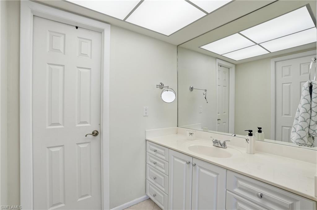 Bathroom with vanity and baseboards