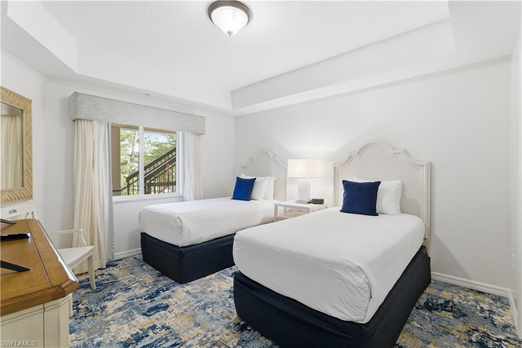 Bedroom with a raised ceiling
