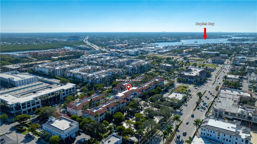 Aerial overview of property's location with nearby urban area and a large body of water