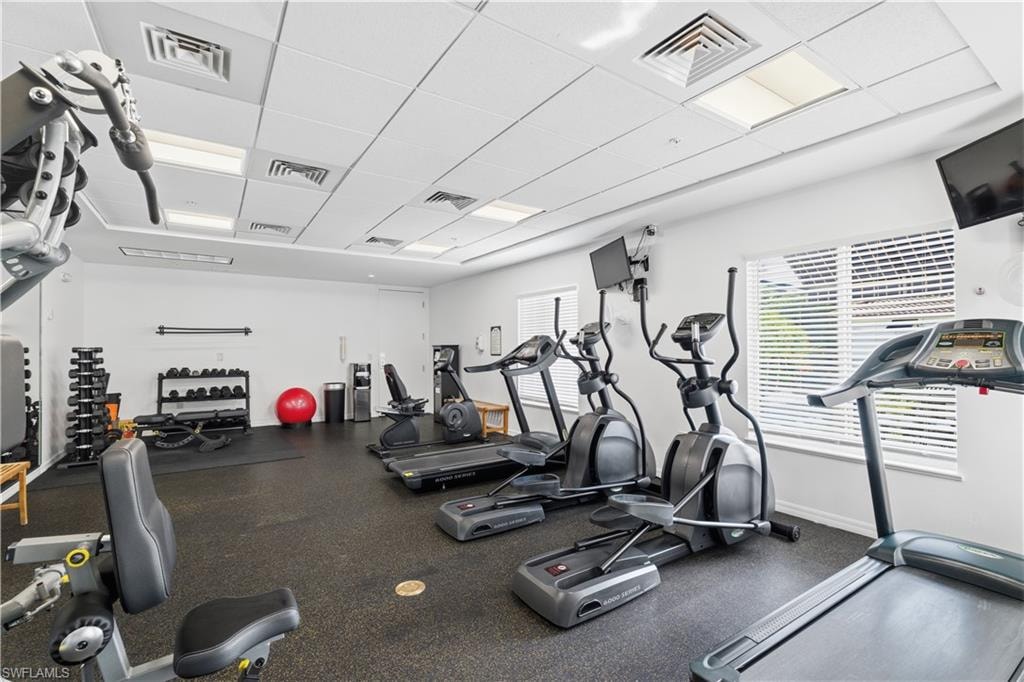 Workout area featuring a drop ceiling