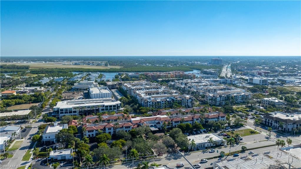 View of property location with nearby urban area and a nearby body of water