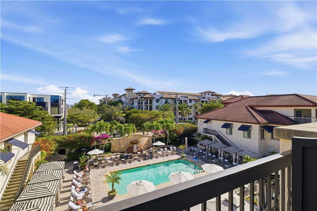 Community pool featuring a balcony