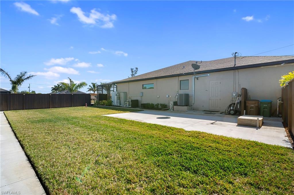 Rear view of property with stucco siding