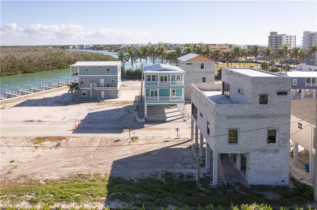 The blueish home across the street is on the market for $1,499,000.