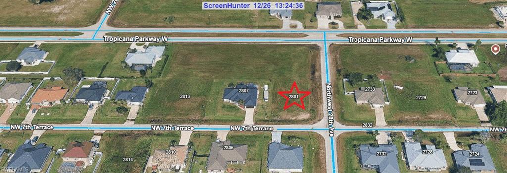 Aerial map of property and surrounding area featuring property with a red star.