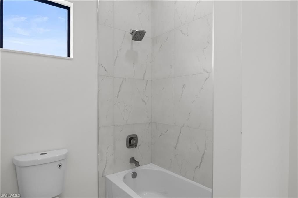 Full bath with shower / bath combination and toilet