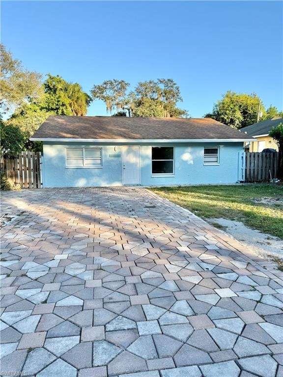 Back of house with a patio