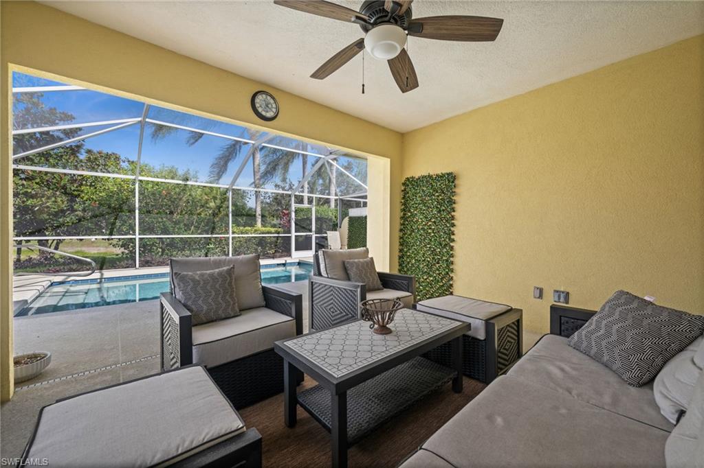View of patio / terrace with a sunroom, an outdoor hangout area, a lanai, and an outdoor pool