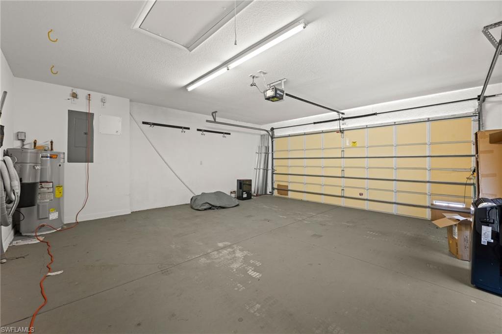 Garage with electric panel and water heater