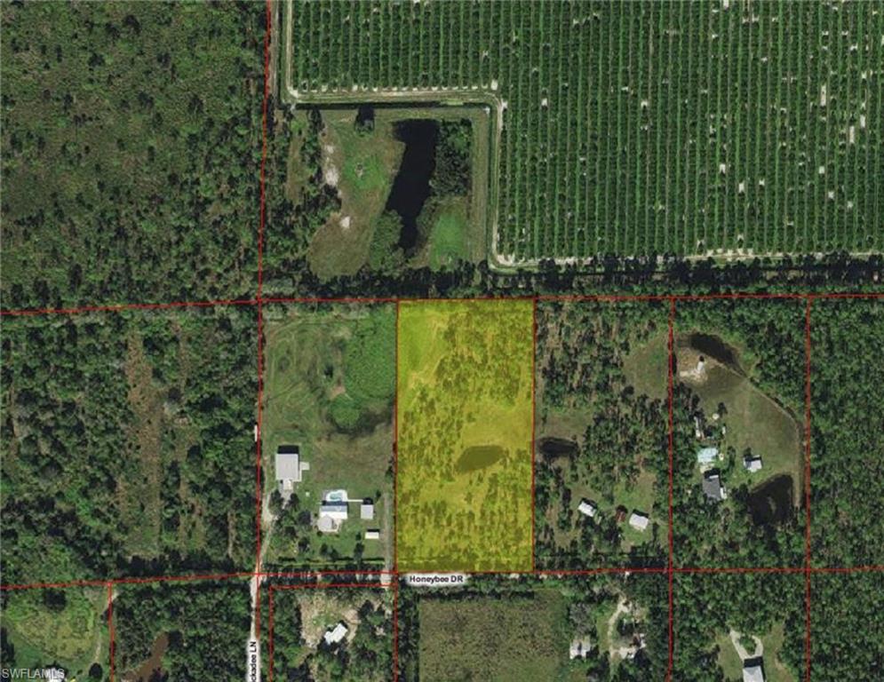 Aerial map of property and surrounding area featuring property boundaries highlighted