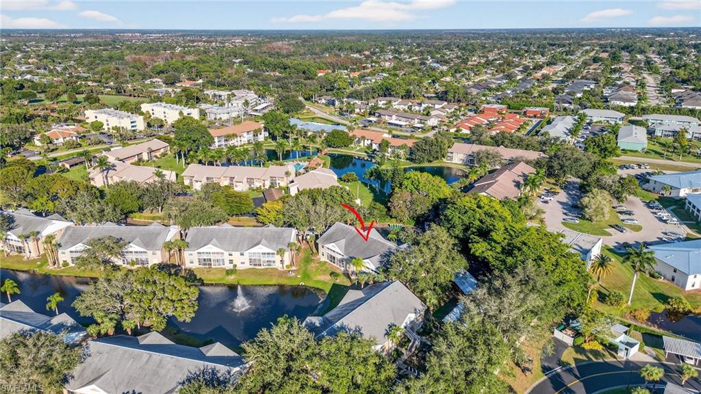 View of property location with nearby suburban area and a nearby body of water
