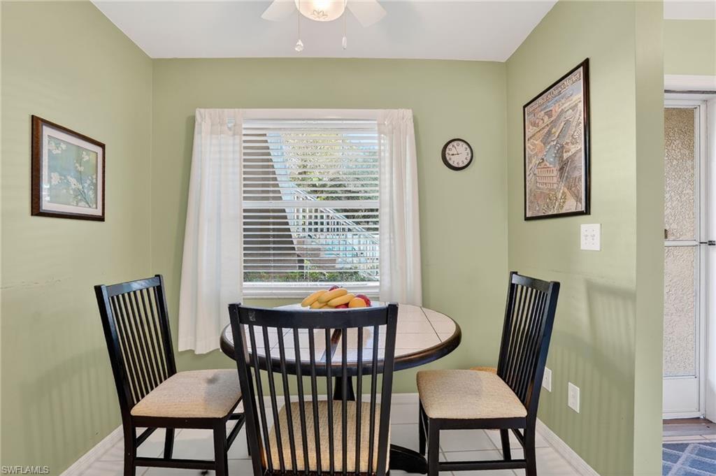 Dining space featuring baseboards and ceiling fan