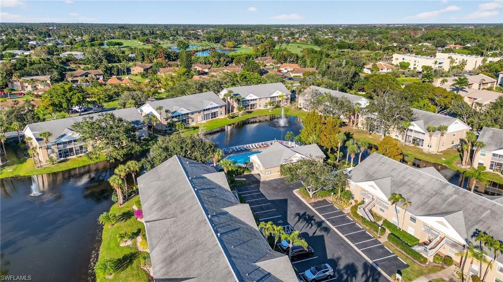 Aerial perspective of suburban area with a large body of water