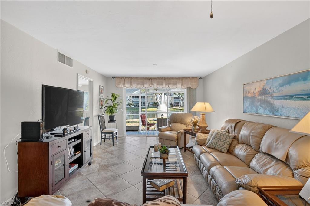 Living area with light tile patterned floors