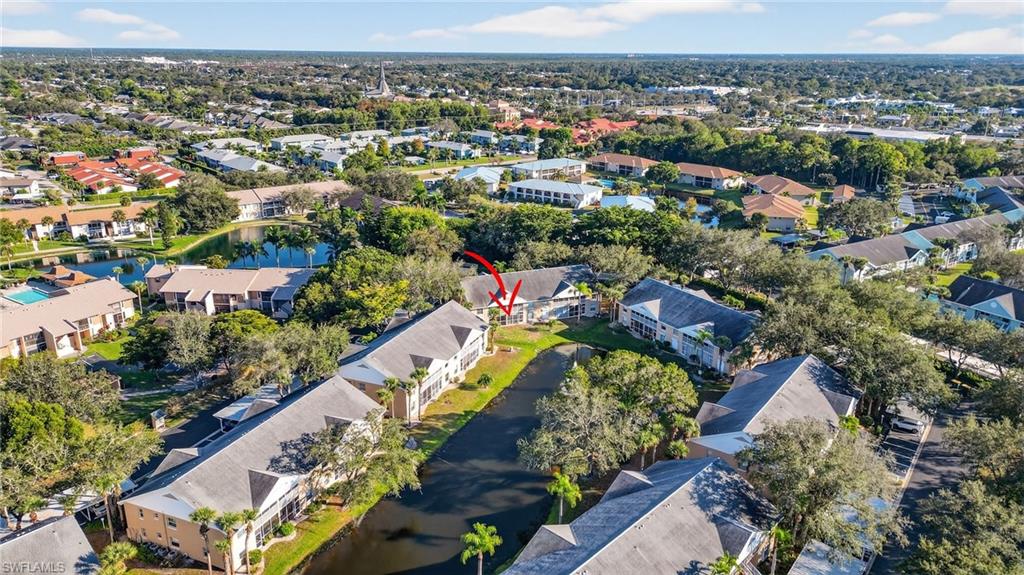 View of property location featuring nearby suburban area and a nearby body of water