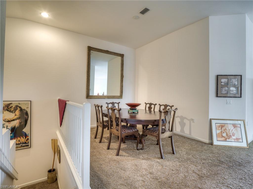 Dining room featuring carpet floors and baseboards