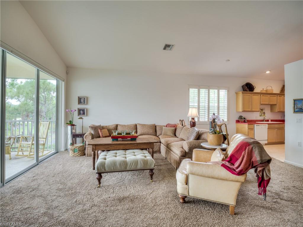 Living area with light colored carpet