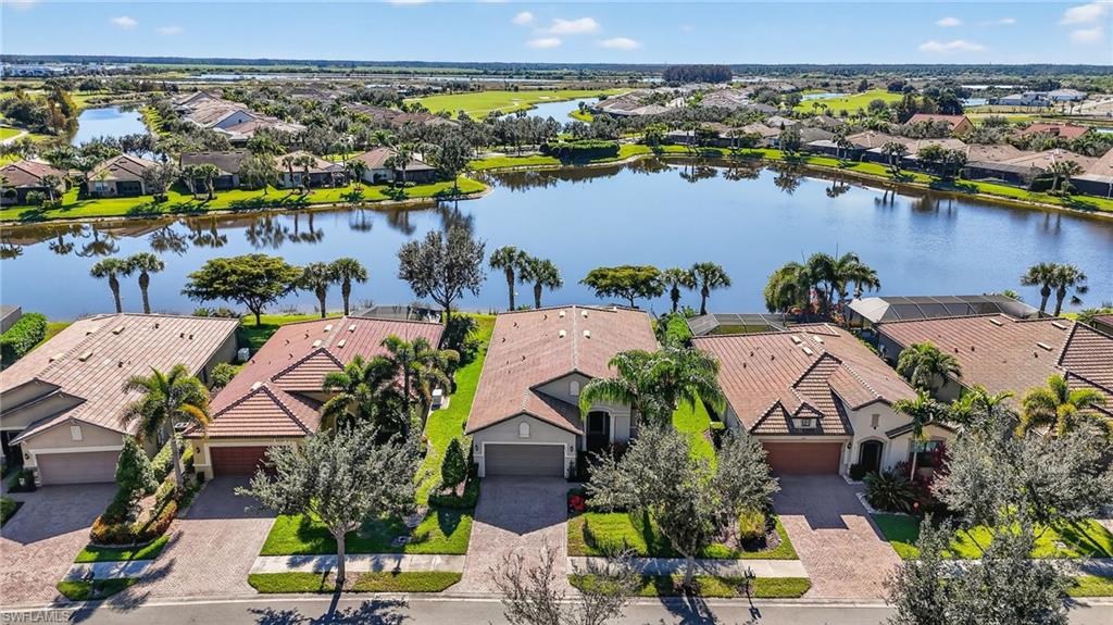 Aerial perspective of suburban area with a large body of water
