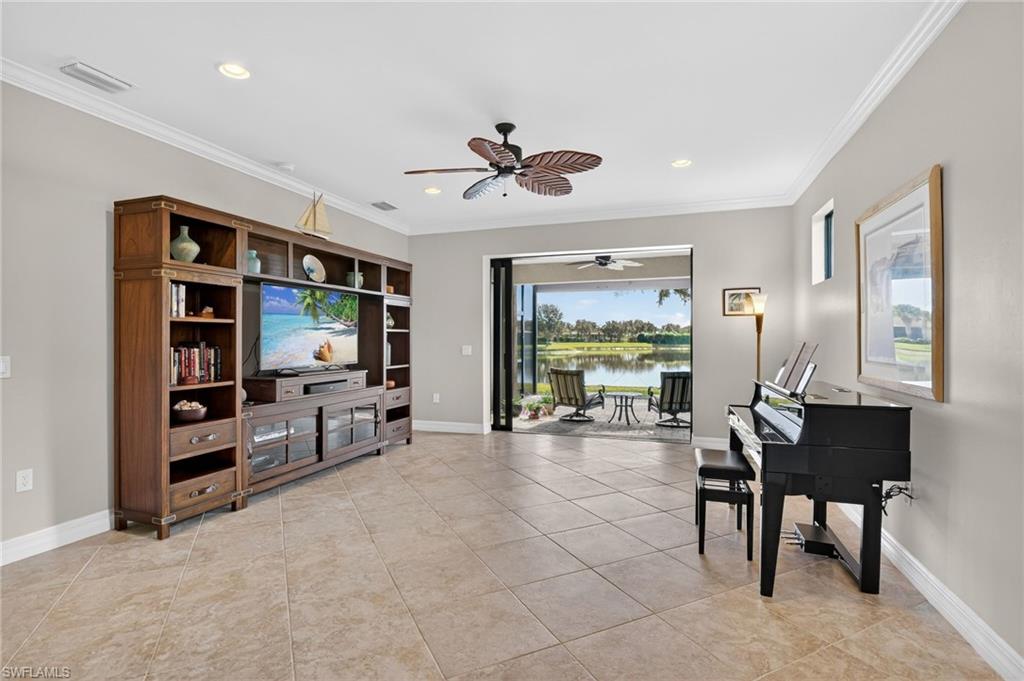 Living area featuring a ceiling fan, light tile patterned floors, ornamental molding, and recessed lighting