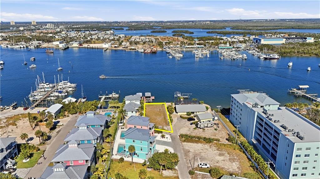 Drone / aerial view of numerous boat docks and a large body of water - Virtually Edited Image