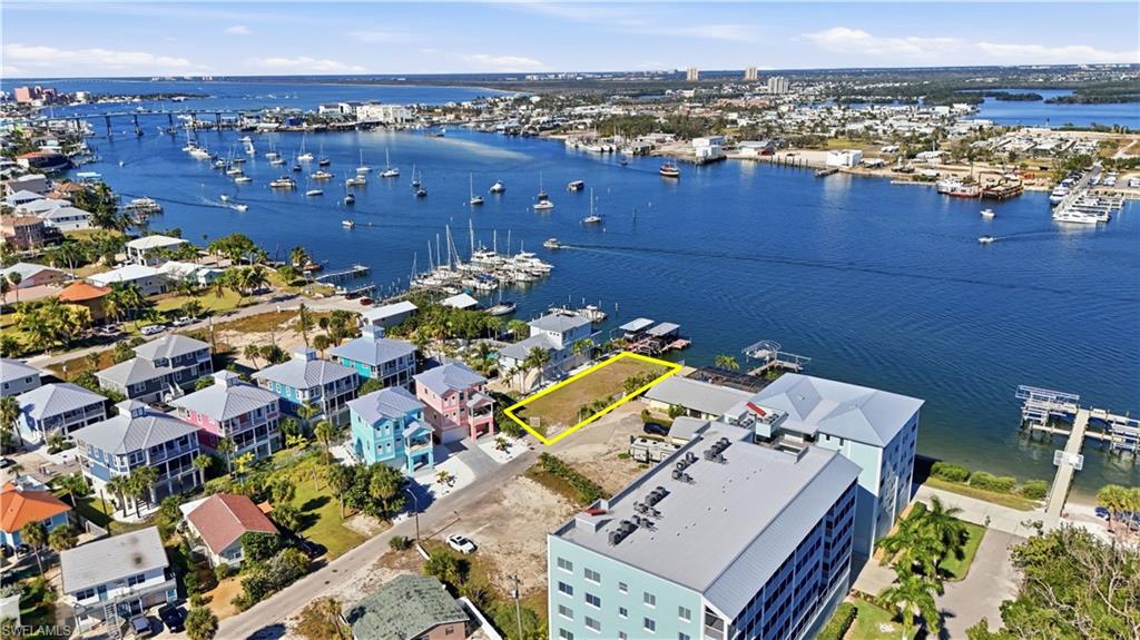 Drone / aerial view of numerous boat docks and a large body of water - Virtually Edited Image