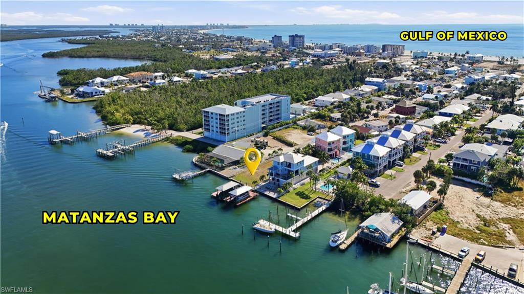 View of urban area featuring a large body of water and numerous boat docks - Virtually Edited Image