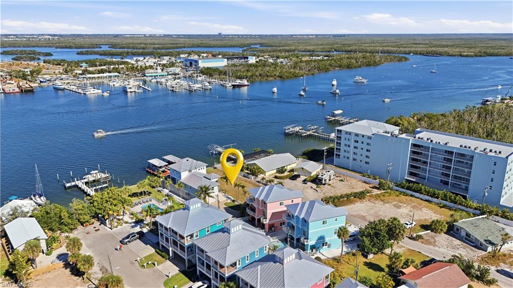 Aerial view of numerous boat docks and a large body of water - Virtually Edited Image