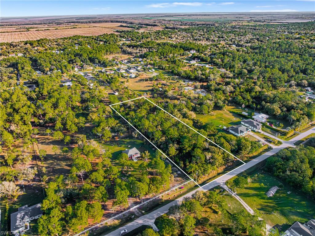 Aerial overview of property's location featuring property parcel outlined