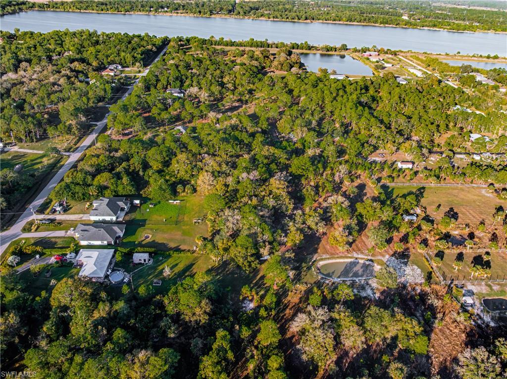 Aerial overview of property's location with a large body of water