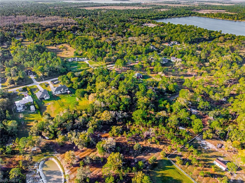 Aerial overview of property's location featuring a heavily wooded area