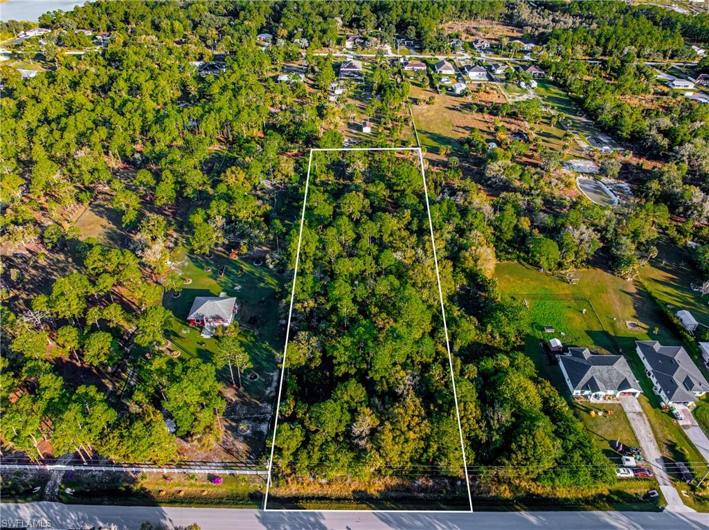 Aerial view of residential area with property boundaries highlighted