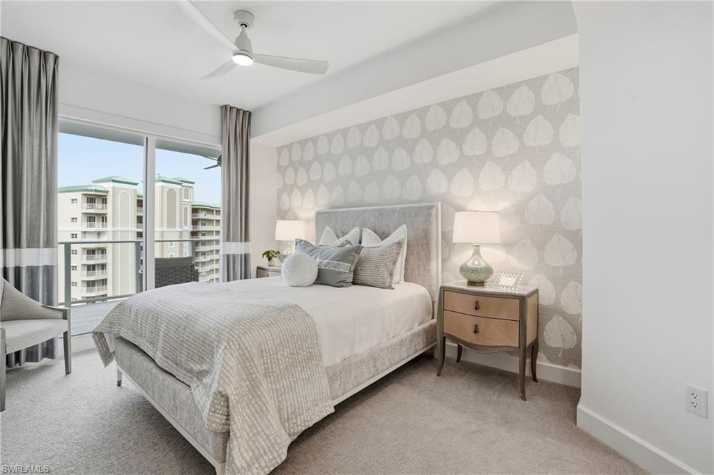 Bedroom with carpet floors, ceiling fan, and wallpapered walls - Virtually Edited Image
