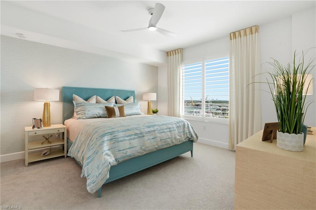 Bedroom featuring light carpet and ceiling fan - Virtually Edited Image