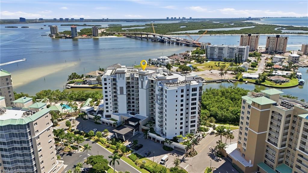 View of urban area with apartment complex and a notable bridge - Virtually Edited Image