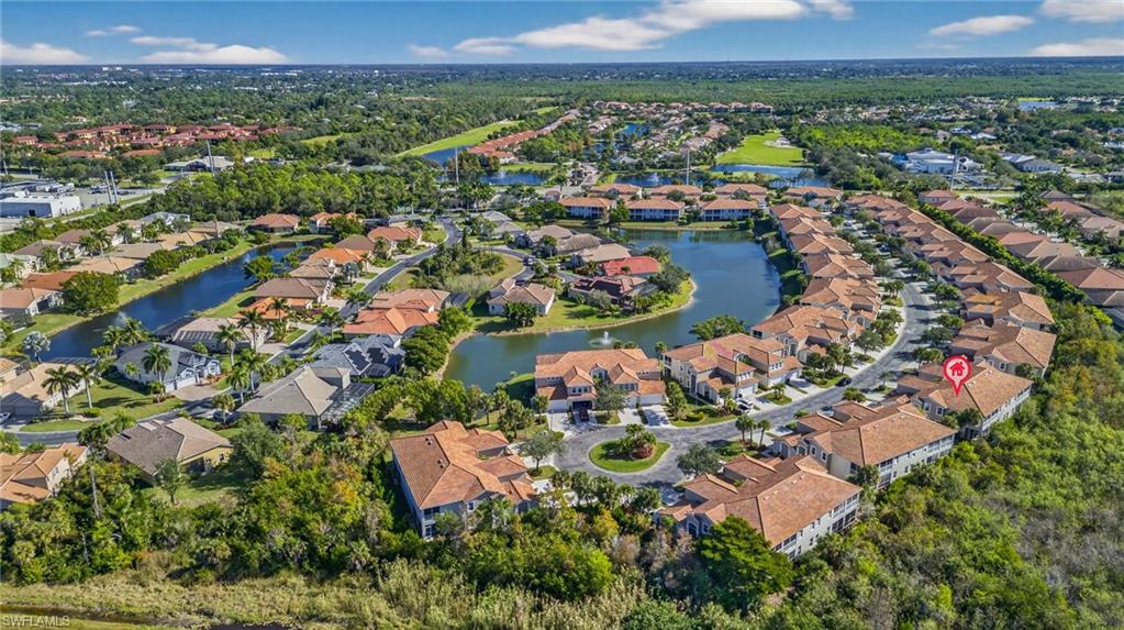 View of property location featuring a nearby body of water and nearby suburban area