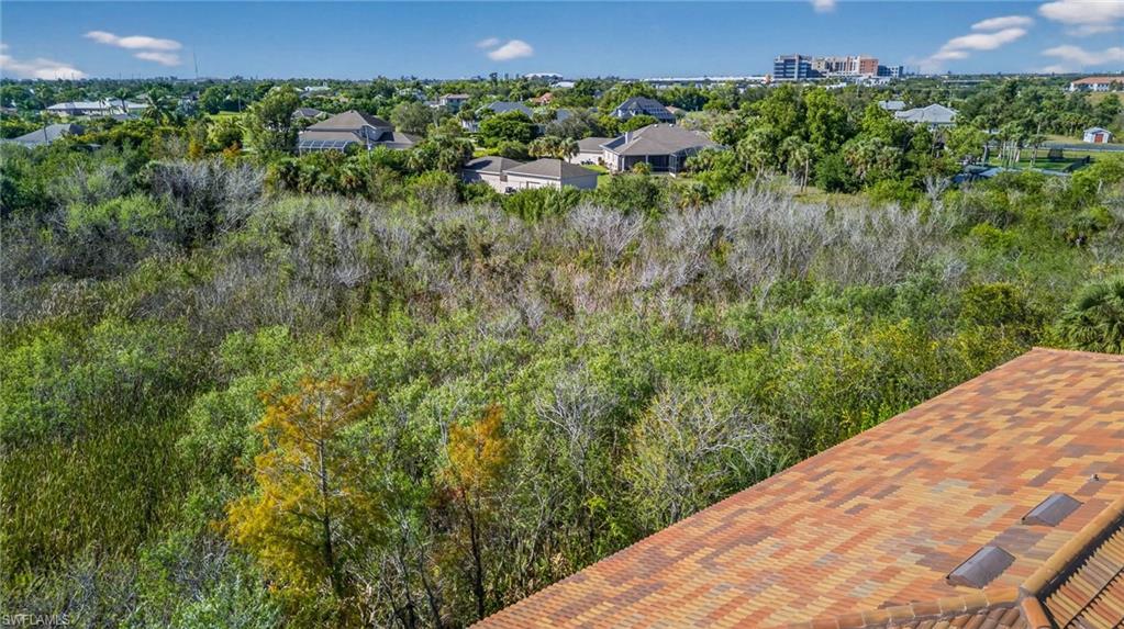 Aerial view of property's location featuring nearby suburban area
