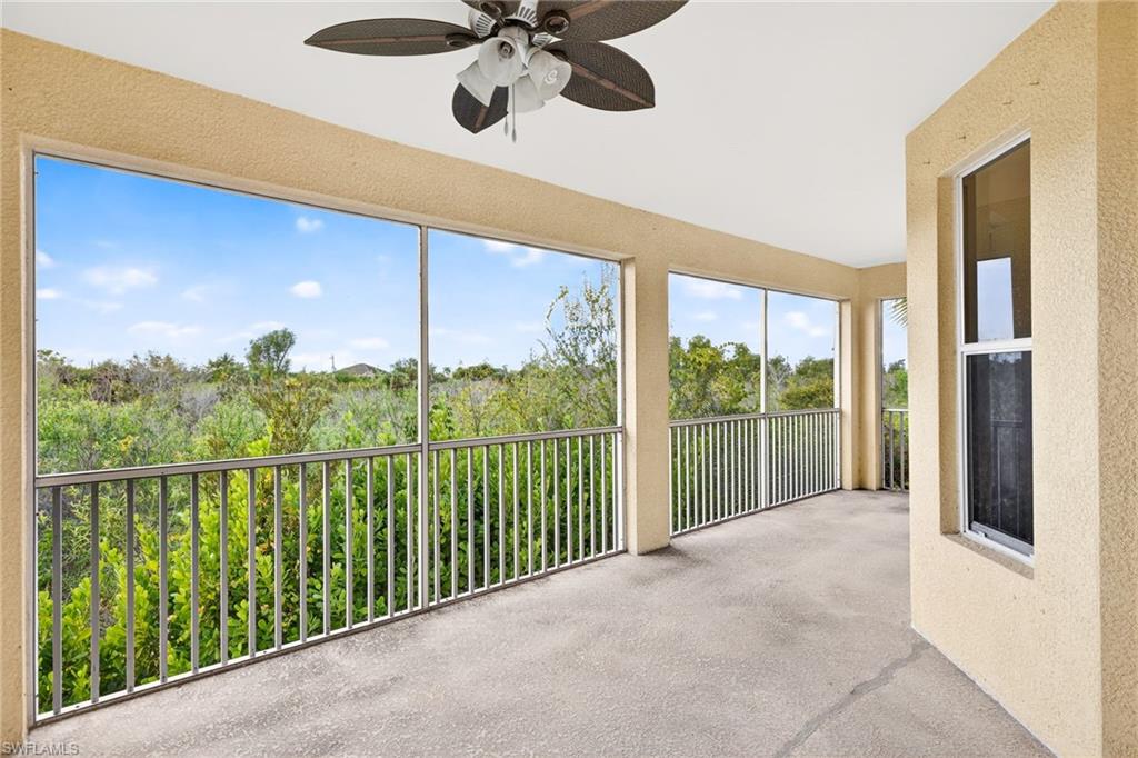 Unfurnished sunroom featuring a textured wall