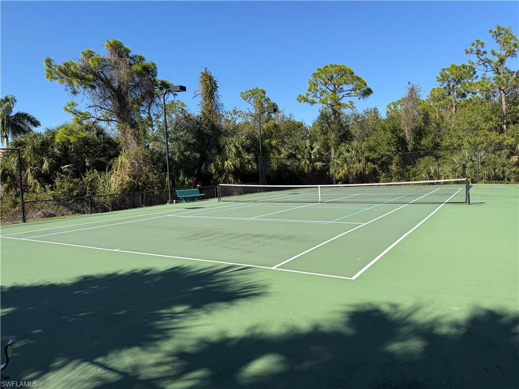 View of tennis court featuring community basketball court