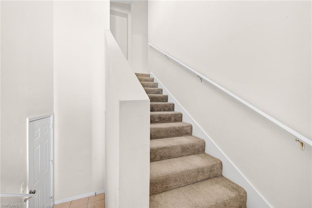 Stairway with a towering ceiling
