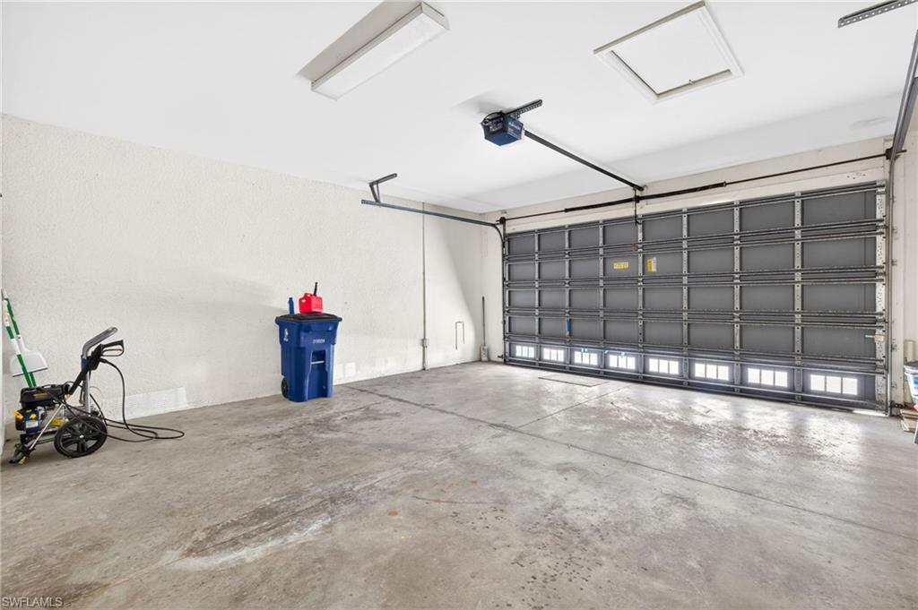 Garage featuring a garage door opener