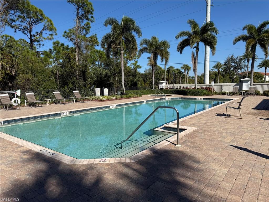 Community pool with a patio area