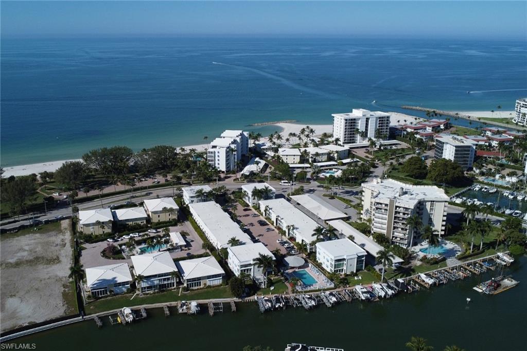 Aerial view of property's location with a large body of water