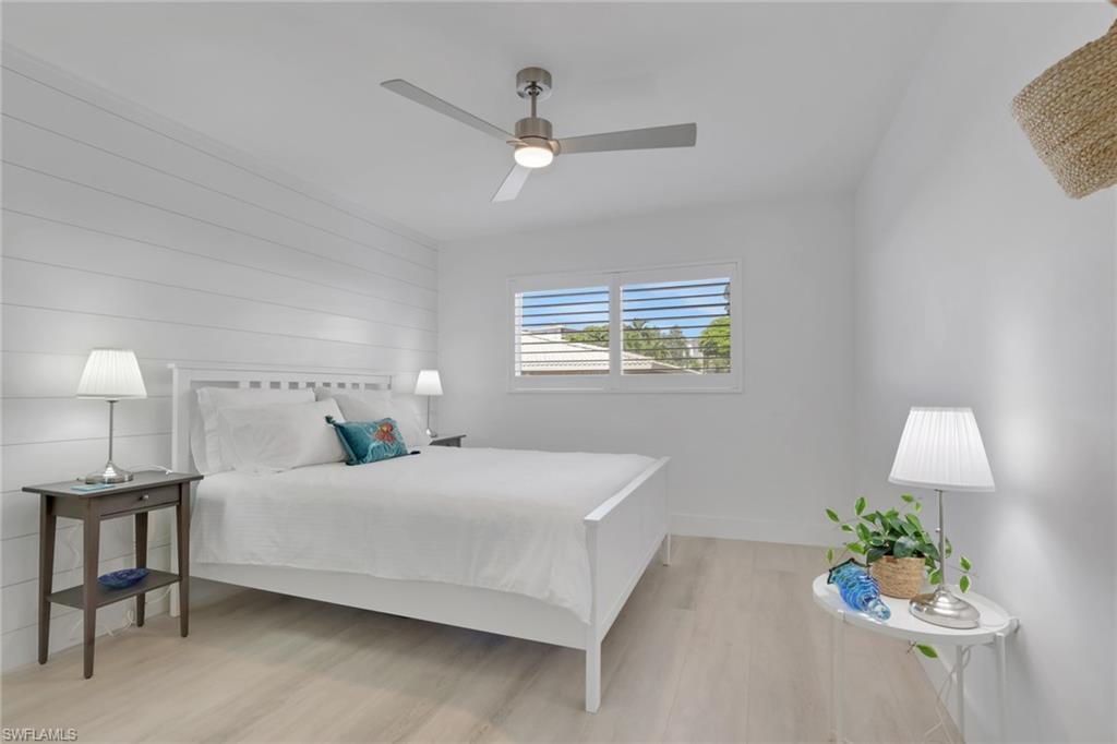 Bedroom featuring light wood finished floors and a ceiling fan