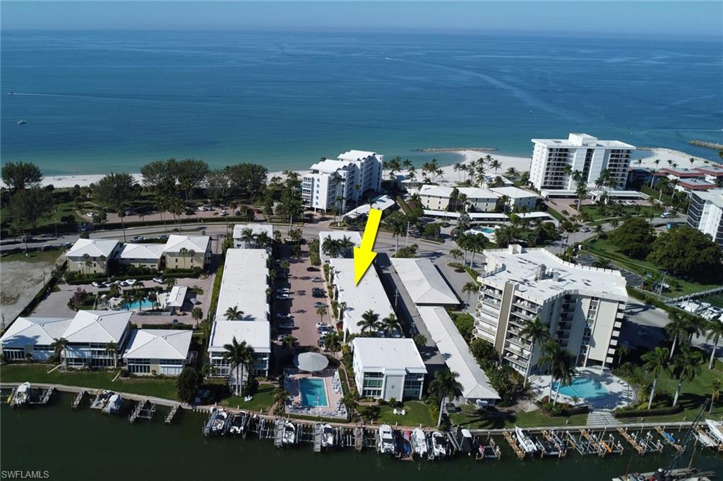 Aerial view of property's location with a nearby body of water