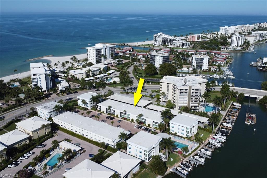 Aerial overview of property's location with a nearby body of water and nearby urban area