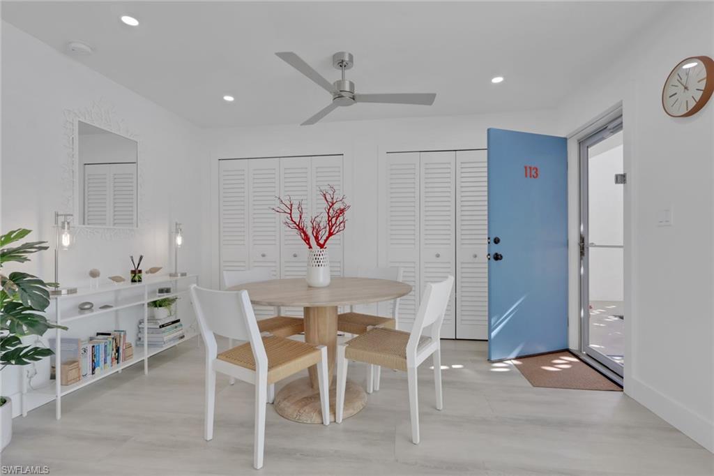 Dining space with a ceiling fan and recessed lighting